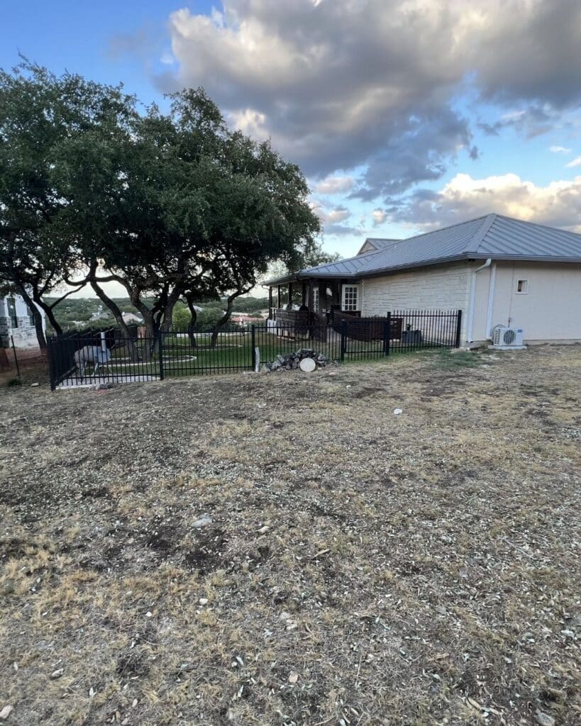 Before view of a sloped Canyon Lake backyard prior to structural retaining wall and patio installation