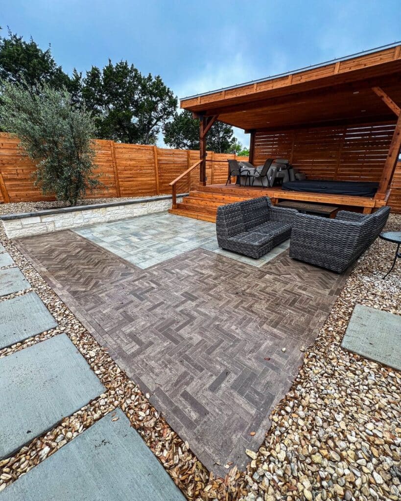 Custom Mattoni double herringbone paver inlay creating a rug effect within a Beacon Hill Fossil patio in Canyon Lake