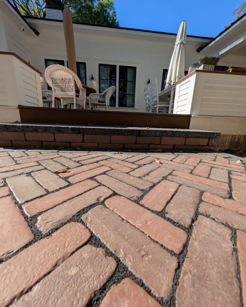 Detail view of Burnt Clay, Old Oak, and Burgundy Red pavers showing Old World street paver texture.